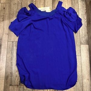 Never worn. Ruffled dress with cold shoulders